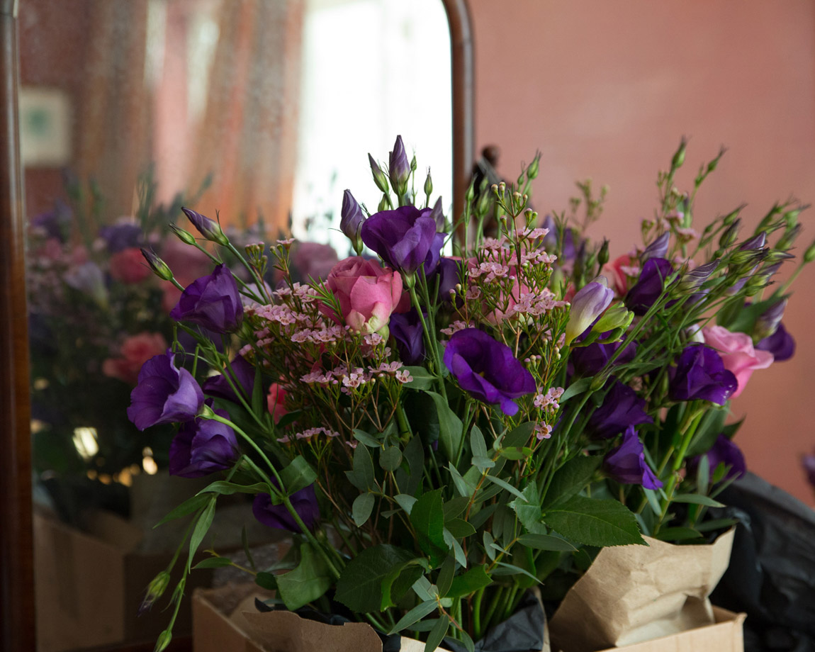 Autumn colours - a wedding bouquet beside a vintage mirror. An October wedding photographed by a passionate wedding photographer based in Leeds, West Yorkshire.