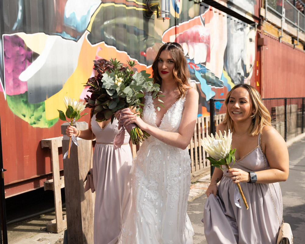 The bride and bridesmaids walking through the streets of York on their way to her Merchant Adventurers Hall wedding.