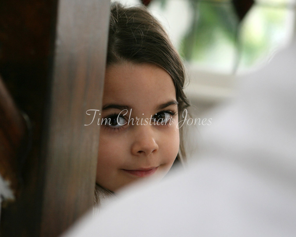 Bride's young daughter photographed during the wedding preparation session
