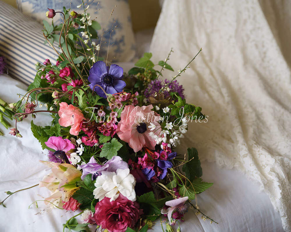 Bridal bouquet placed by the wedding dress