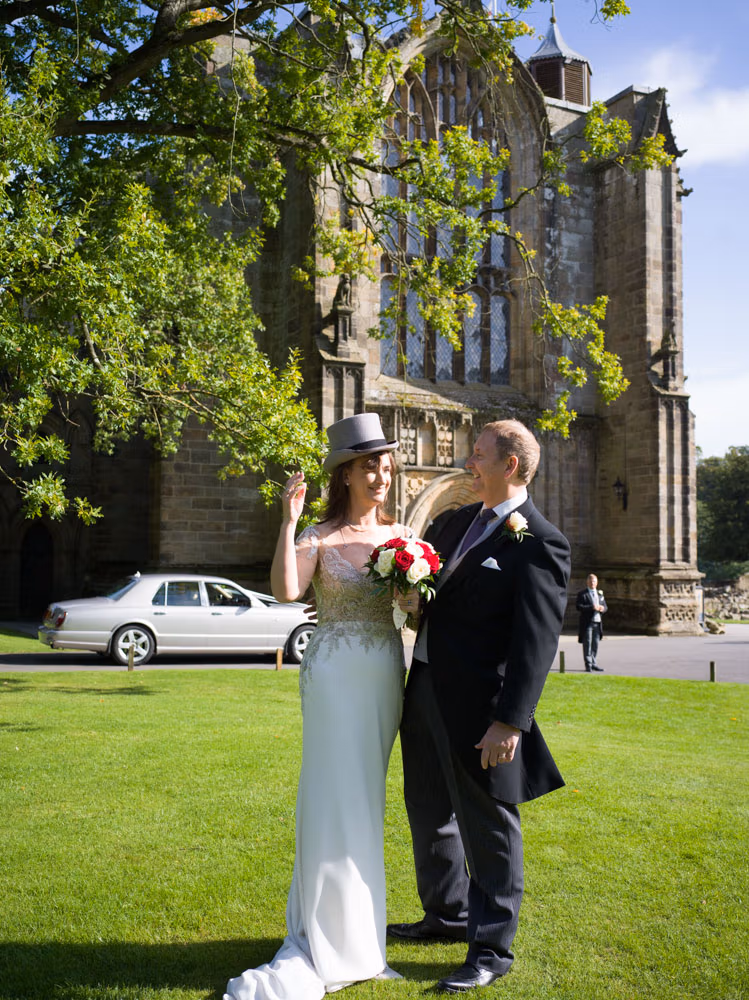 Bolton Priory and Devondhire Arms wedding - Candid Couple Portrait outside the church