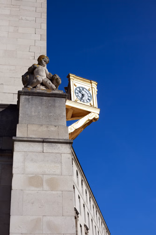 The clock on the side of Leeds Civic Hall under blue skies on Gemma and Danny’s wedding day