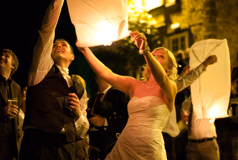 Bride and groom prepare lantern together Dani and Scott’s Hoyle Court Wedding