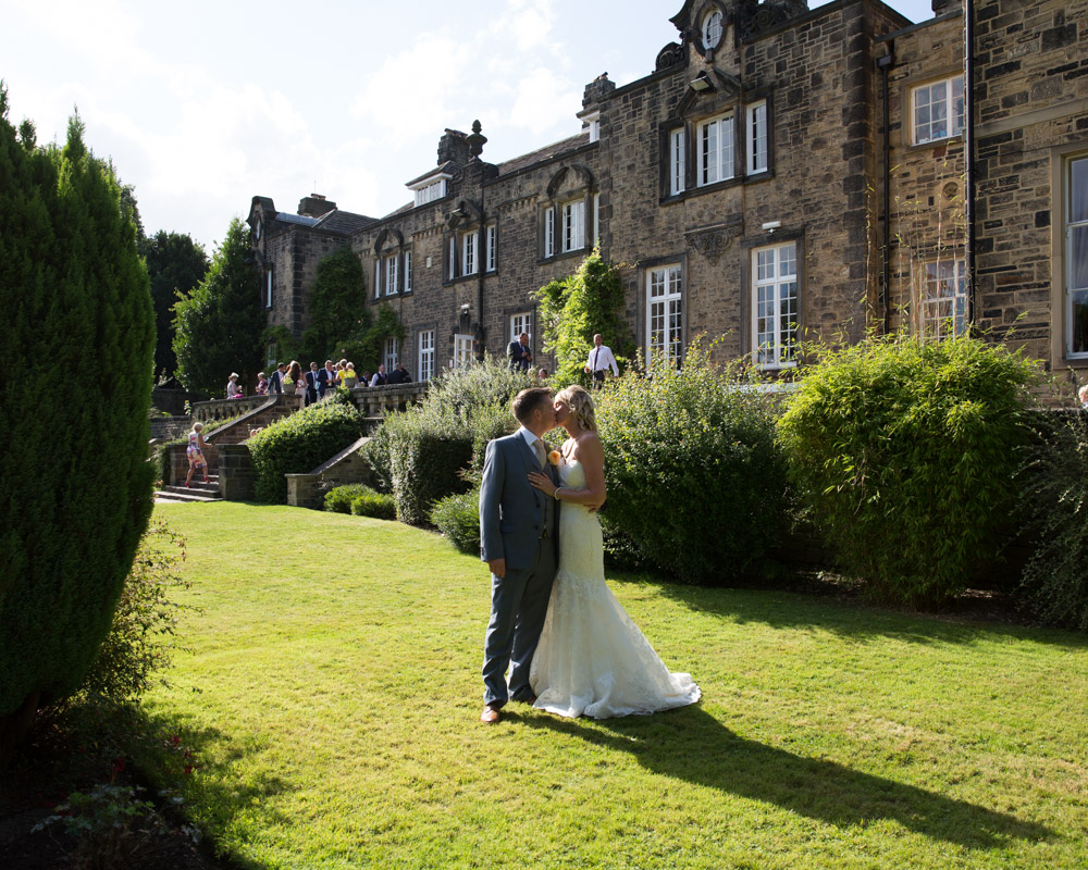 Debra and Jared share a quiet moment on the lawn at Hoyle Court beneath the summer sky.