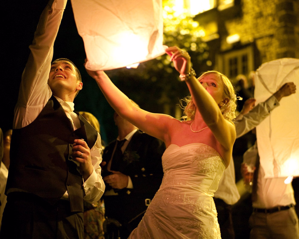 An evening reception moment captured at Hoyle Court - Dani & Scott's April wedding story captured by a Leeds wedding photographer. Chinese Lanterns released into the night sky on this April wedding at one of Yorkshire's lovely wedding venues.