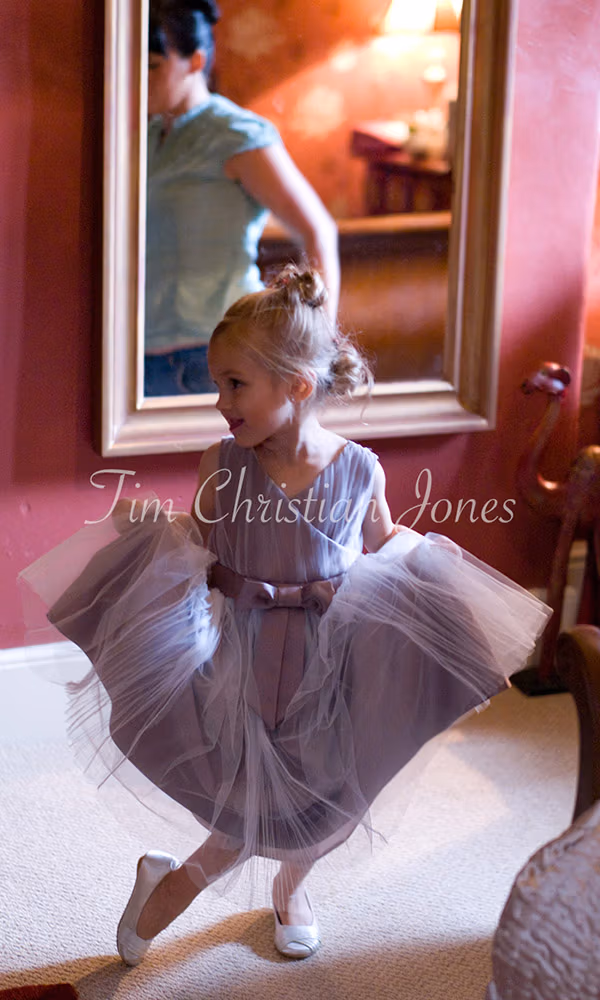 Little bridesmaid poses for a photo
