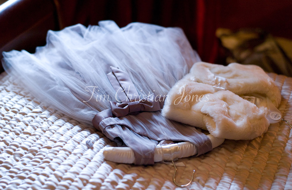 Bridesmaid dress captured in beautiful colour and natural light at a rustic wedding venue photographed by Tim Christian Jones | Leeds wedding photographer