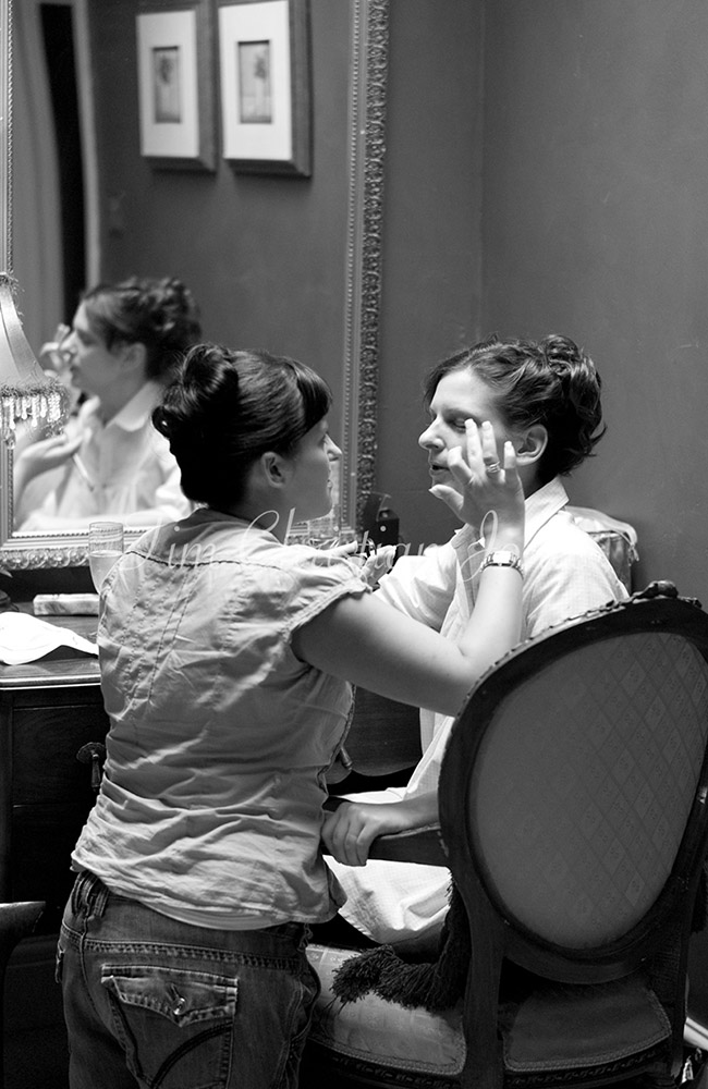 Bride, and her sister helping with makeup