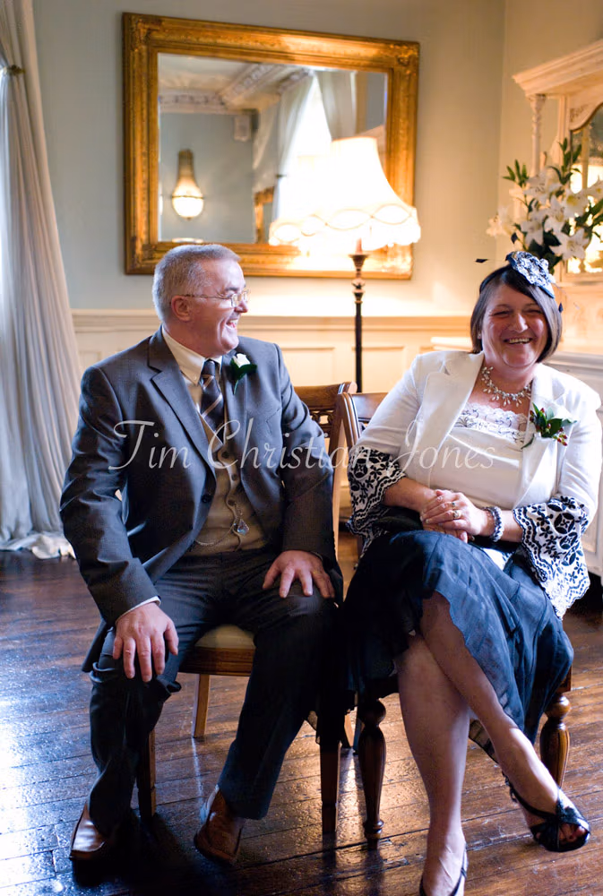 A calm portrait of Julie’s father with his wife — a moment of quiet strength and love.