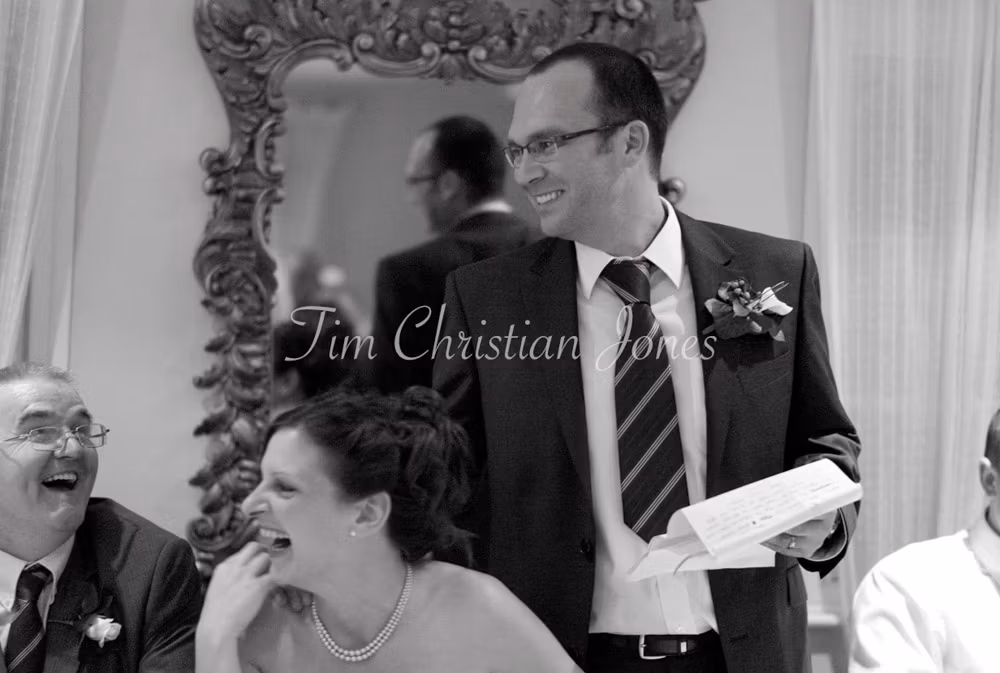 Pat’s speech draws laughter and smiles from guests seated along the top table.