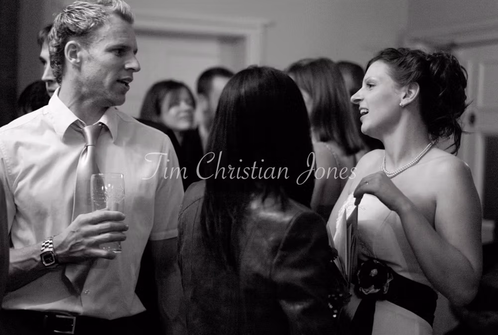 Julie moves through the crowd, chatting easily with evening guests.