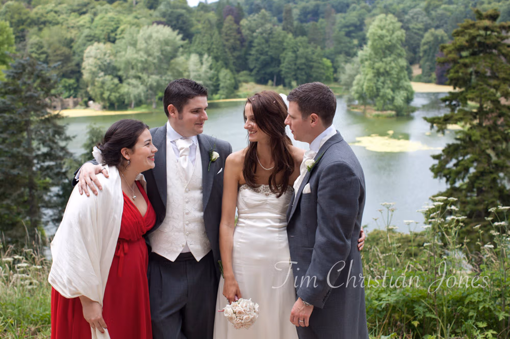 Couple with the best man and his girlfriend outdoors at the wedding