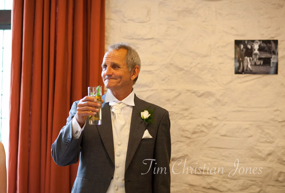 Father of the bride raises a toast to the couple