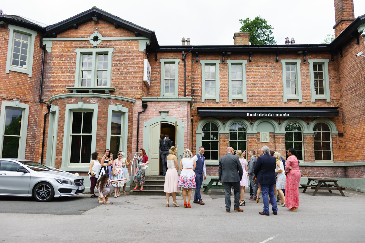 Guests gathering outside The Faversham wedding venue in Leeds