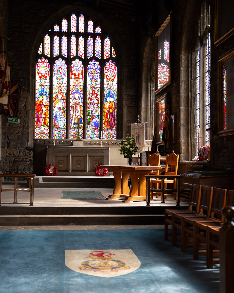 Interior of the Halifax Minster vestry, stained glass glowing in the quiet before the ceremony.