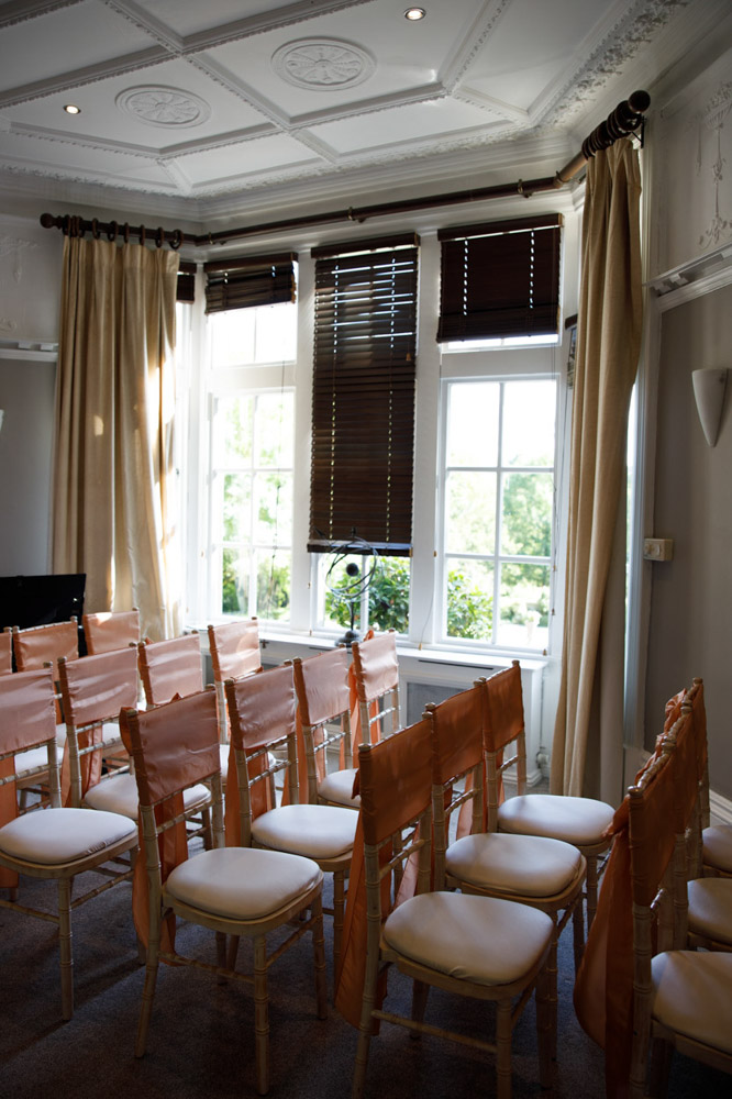Ceremony room at The Woodlands with ornate ceilings and chairs set out