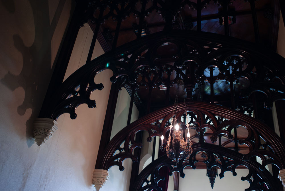 Ornate wooden arches and hallway details inside the wedding venue