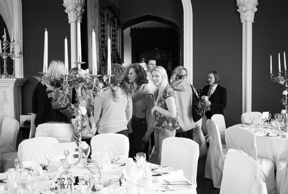 Bride Vicky peeking into the wedding breakfast room before prep begins