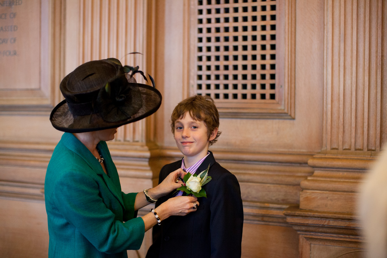 Groom’s son having his buttonhole pinned inside the Banquet Hall.