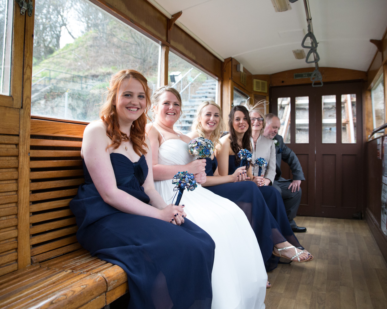 Bride and bridesmaids arriving at the Scarborough cliff lift before the ceremony at Scarborough Spa.