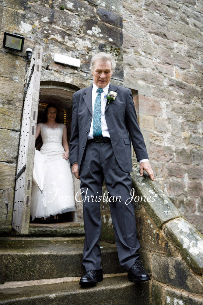 Father of the bride walking down stone steps at The Priests House, Barden Tower.