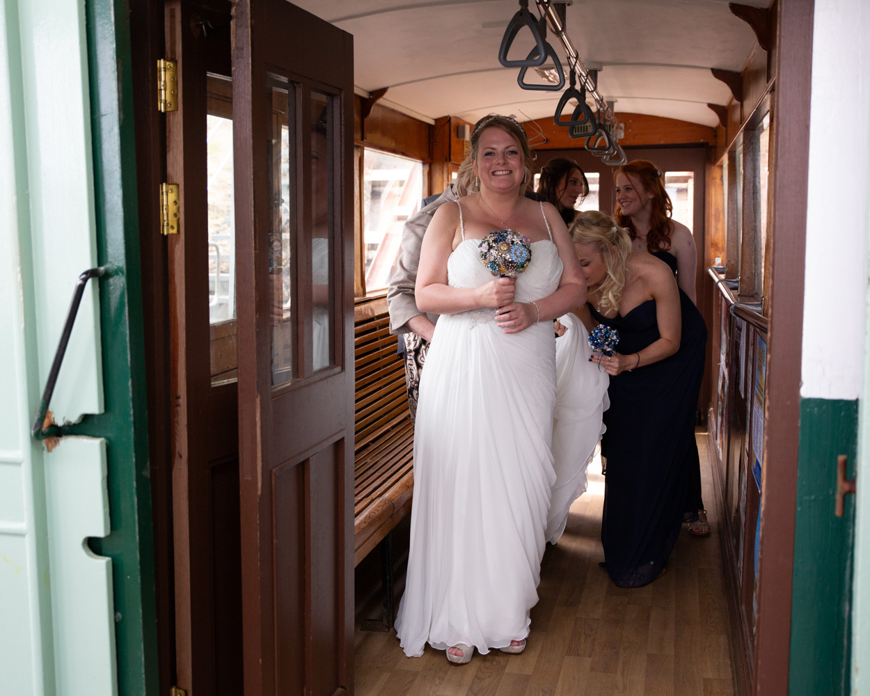 Happy candid moments inside the Scarborough cliff lift as the bridal party enjoy the ride together.
