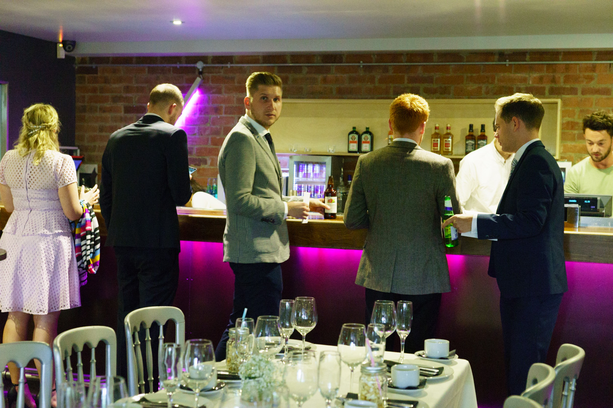 Guests chatting at The Faversham bar before the ceremony