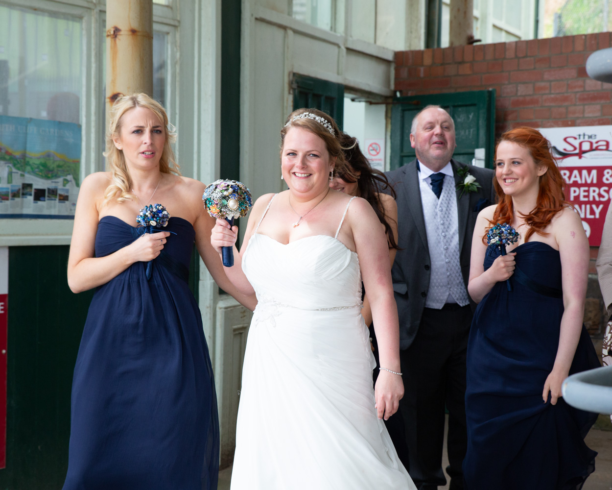 Bride and bridal party preparing to step off the historic cliff lift in Scarborough, moments before the ceremony.