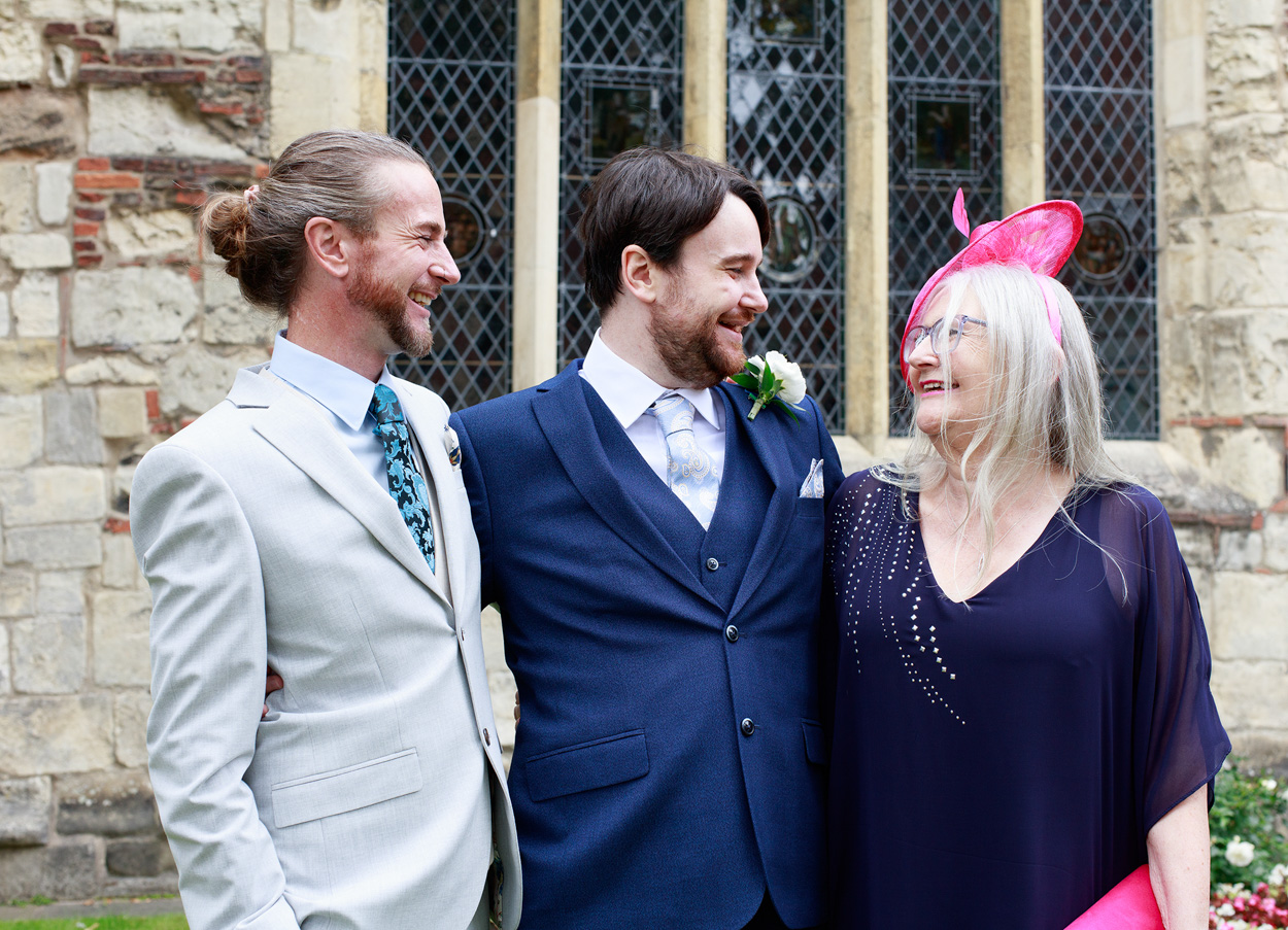 Chris talks with his brother and mother in a candid moment before the ceremony.