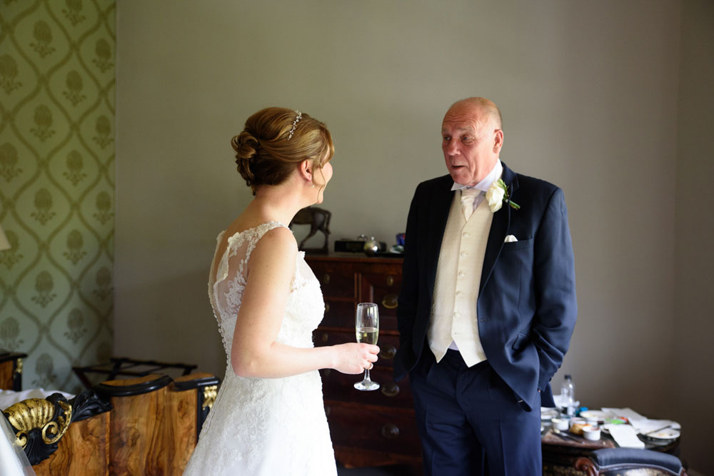 Bride’s father sees his daughter in her dress for the first time.