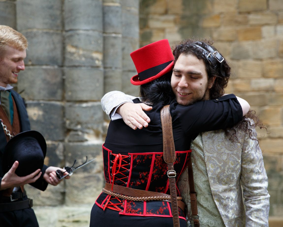 012 groom hugs guest kirkstall abbey wedding linsey and chris
