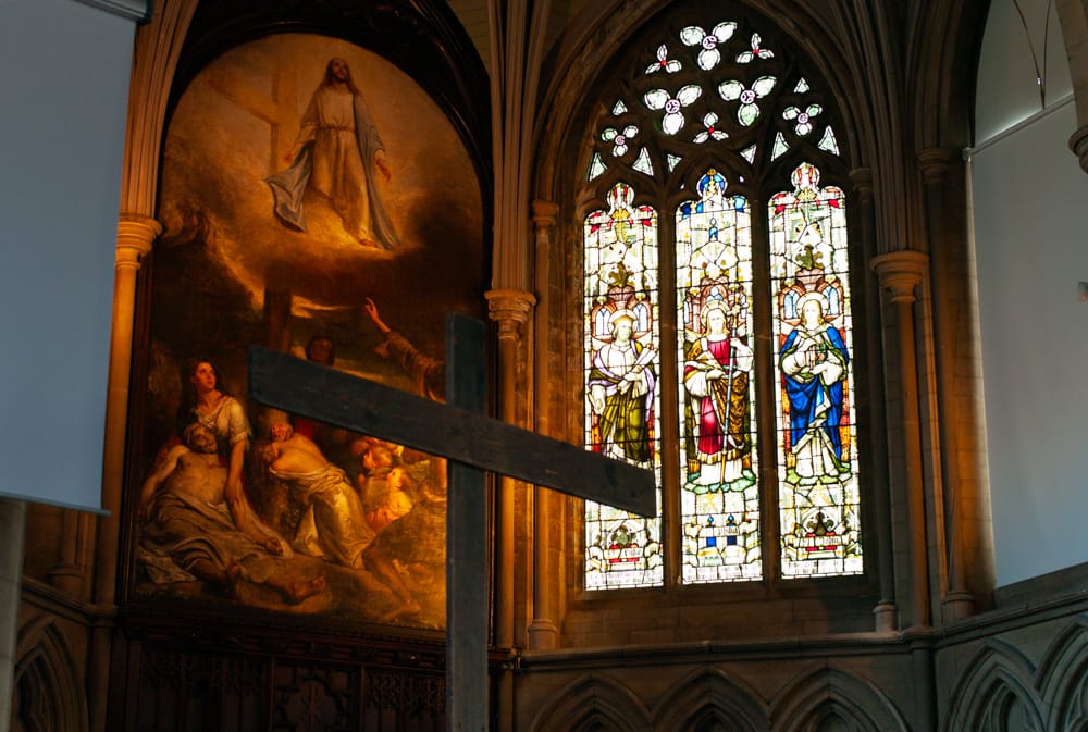 Grand interior of St George’s Church Leeds, stained glass window and artwork above altar.