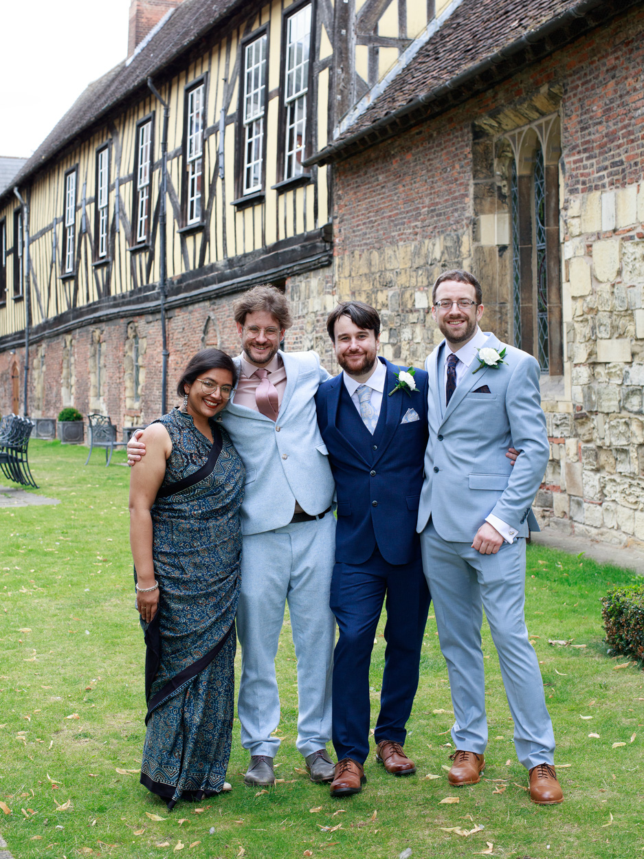 Chris and David pose with Sam and Joe, whose wedding took place at Merchant Adventurers’ Hall in 2017.