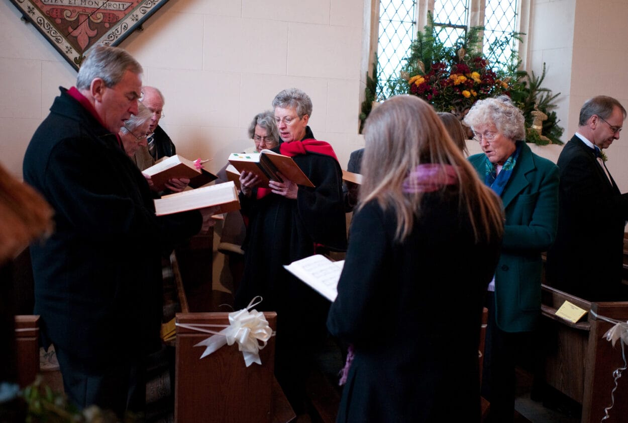 The choir warms up their voices for the winter ceremony.