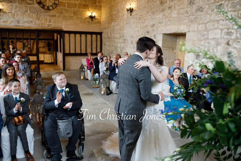 Emotional first kiss during The Priests House wedding ceremony.