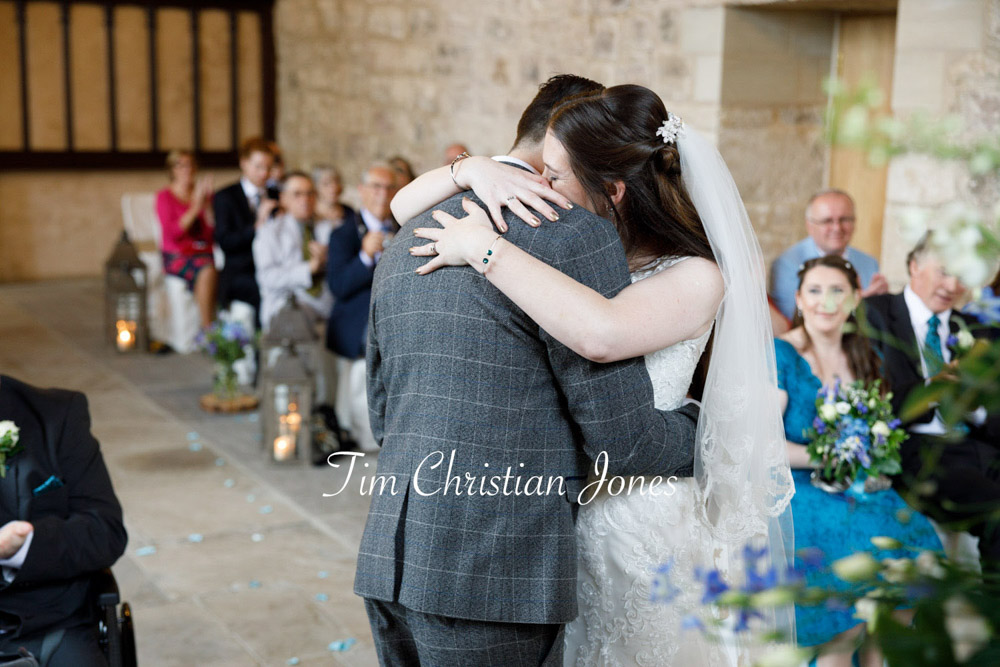 Emotional hug after ceremony during romantic Yorkshire wedding
