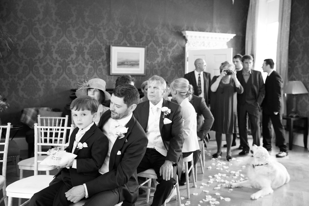 Their son, the ring bearer, is ready as more guests begin to arrive.
