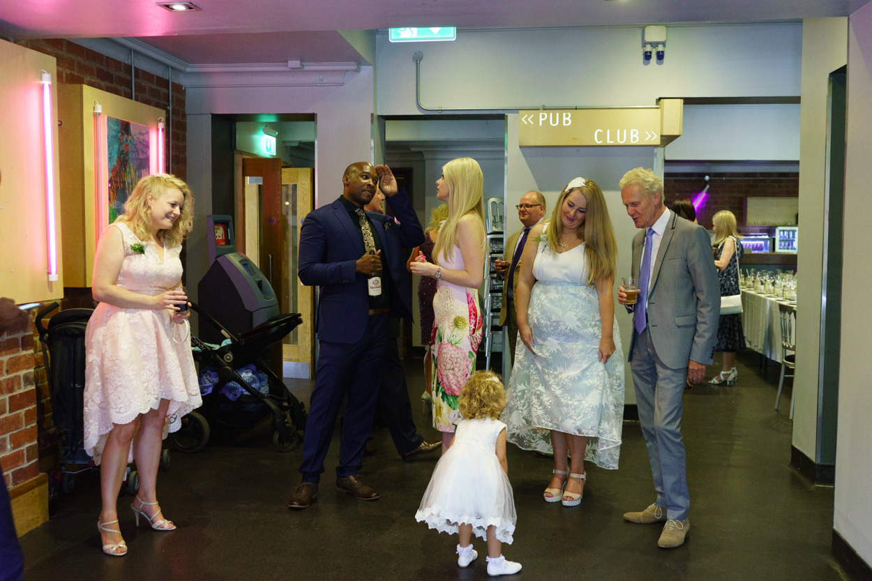 Little girl enjoying attention at a wedding celebration