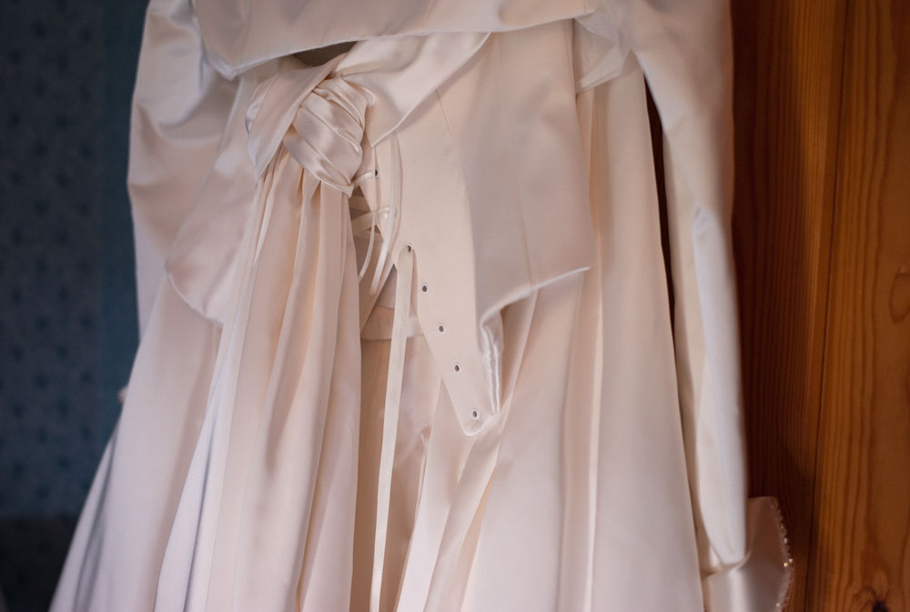 Lace and satin detail on the back of the wedding dress.