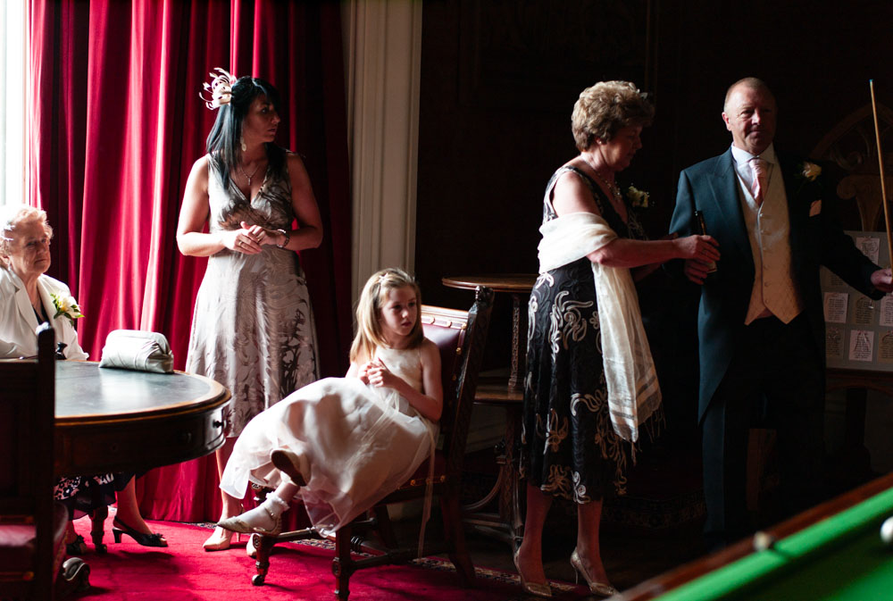 Guests relax in the snooker room at Allerton Castle, bathed in natural light.