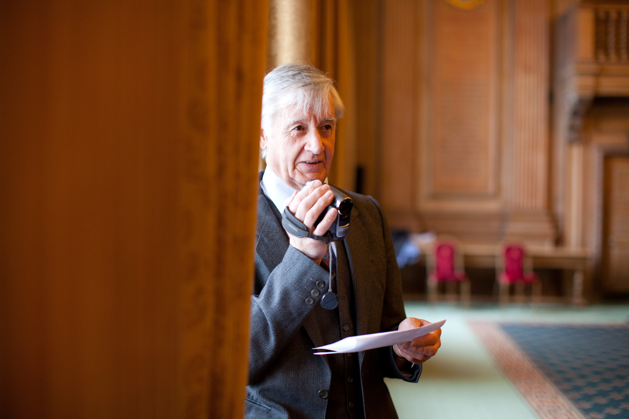 Friend discreetly filming the ceremony from behind a curtain inside Leeds Civic Hall.