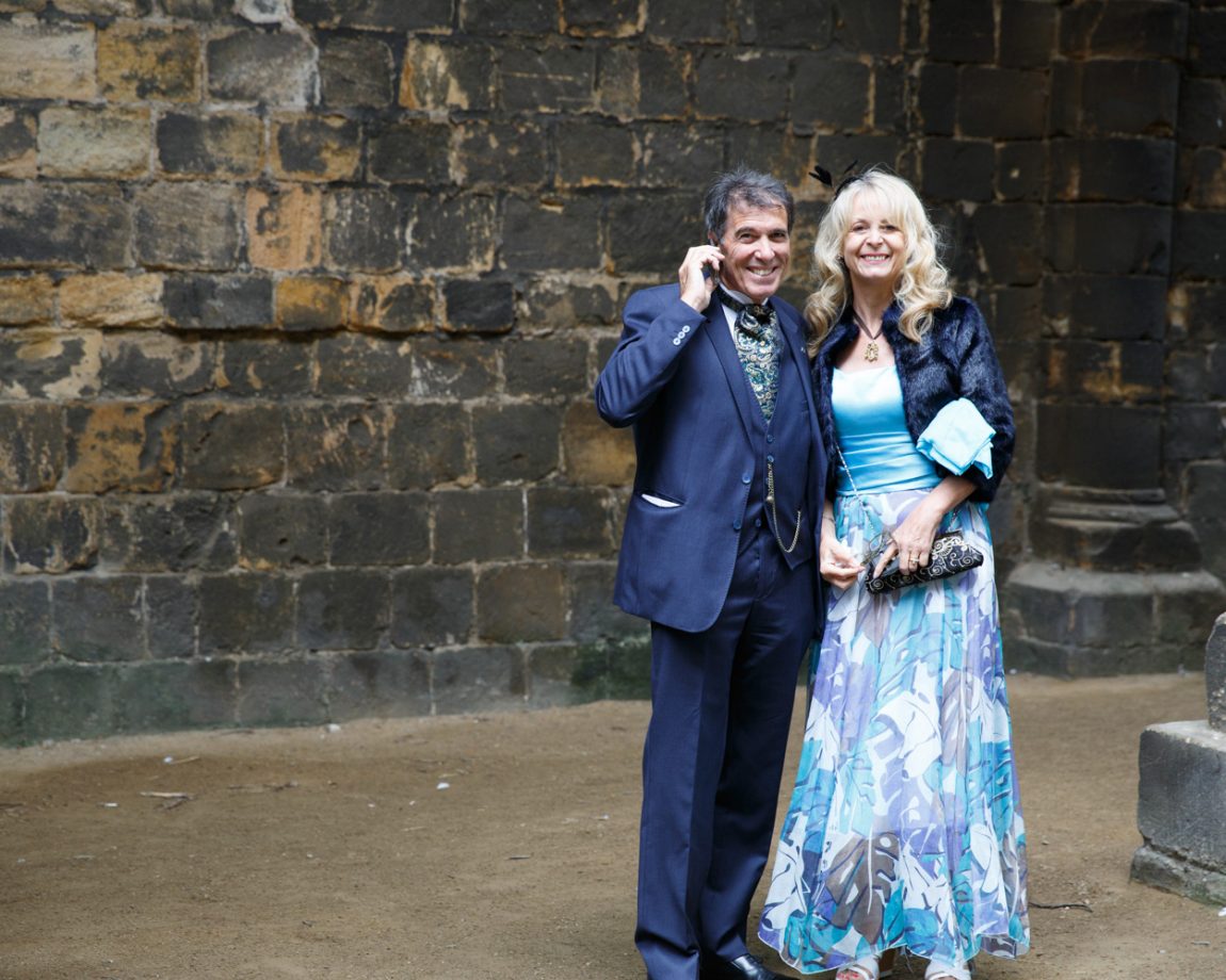 021 couple stood aside pose smiling kirkstall abbey wedding linsey and chris