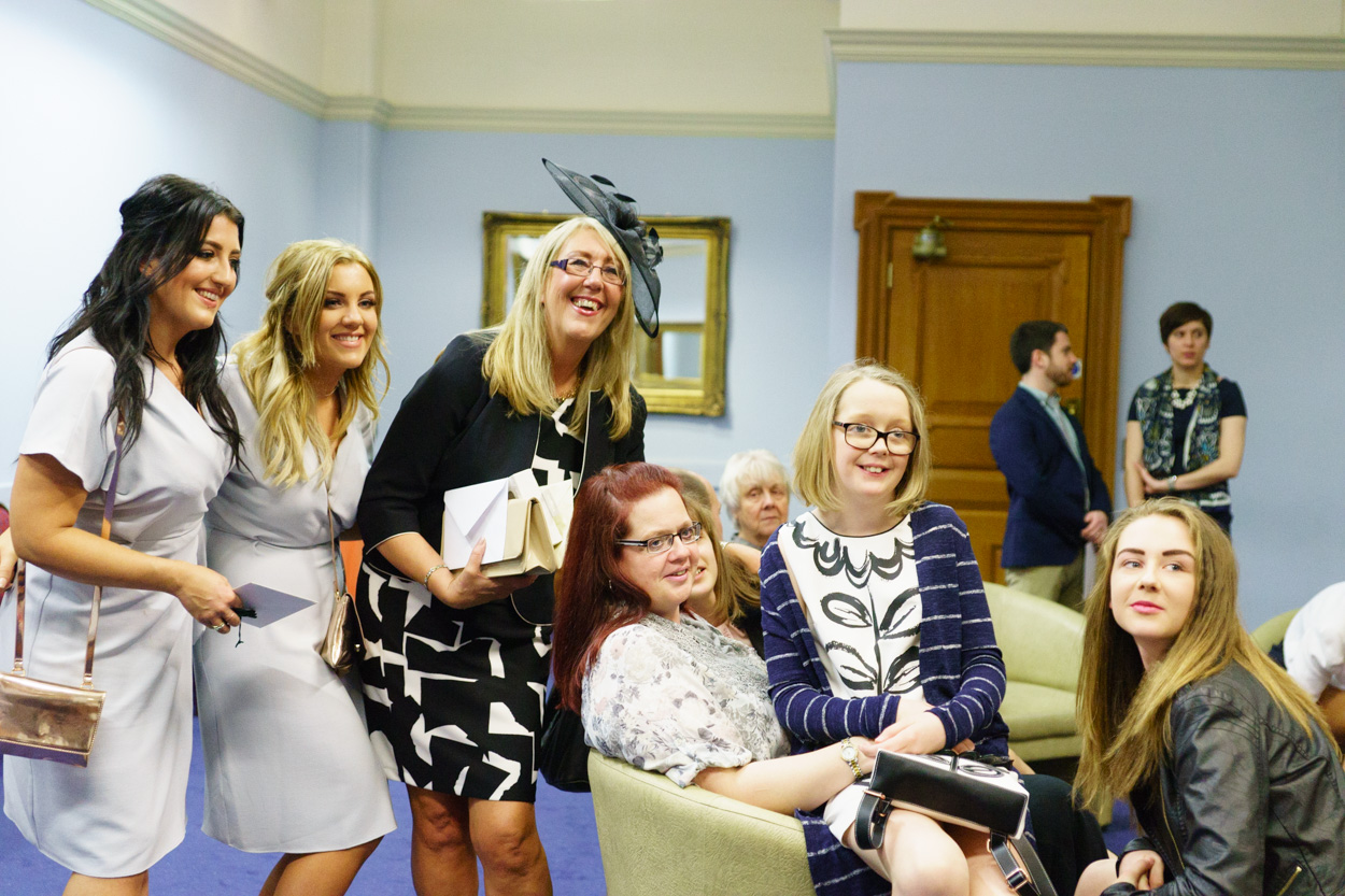 Friends taking photos together before the ceremony