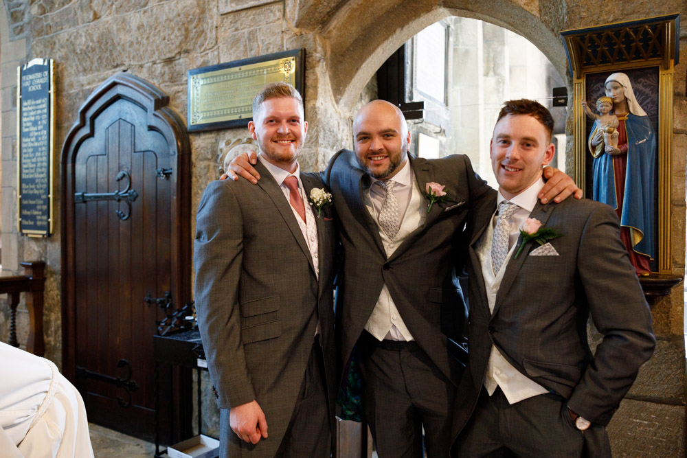 Matt stands with his two best men — one mid-laugh, the other full of character.