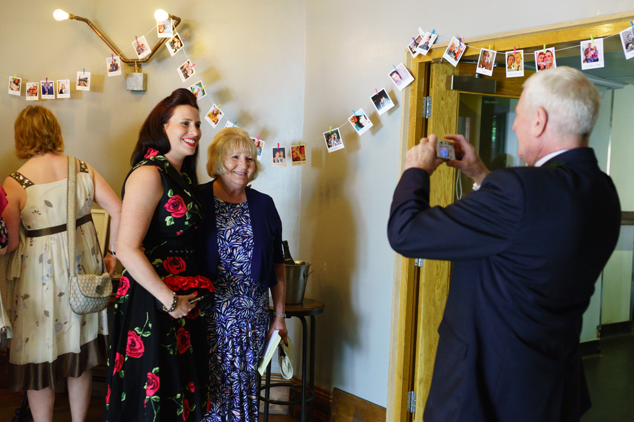 Friends photographing friends at an intimate wedding