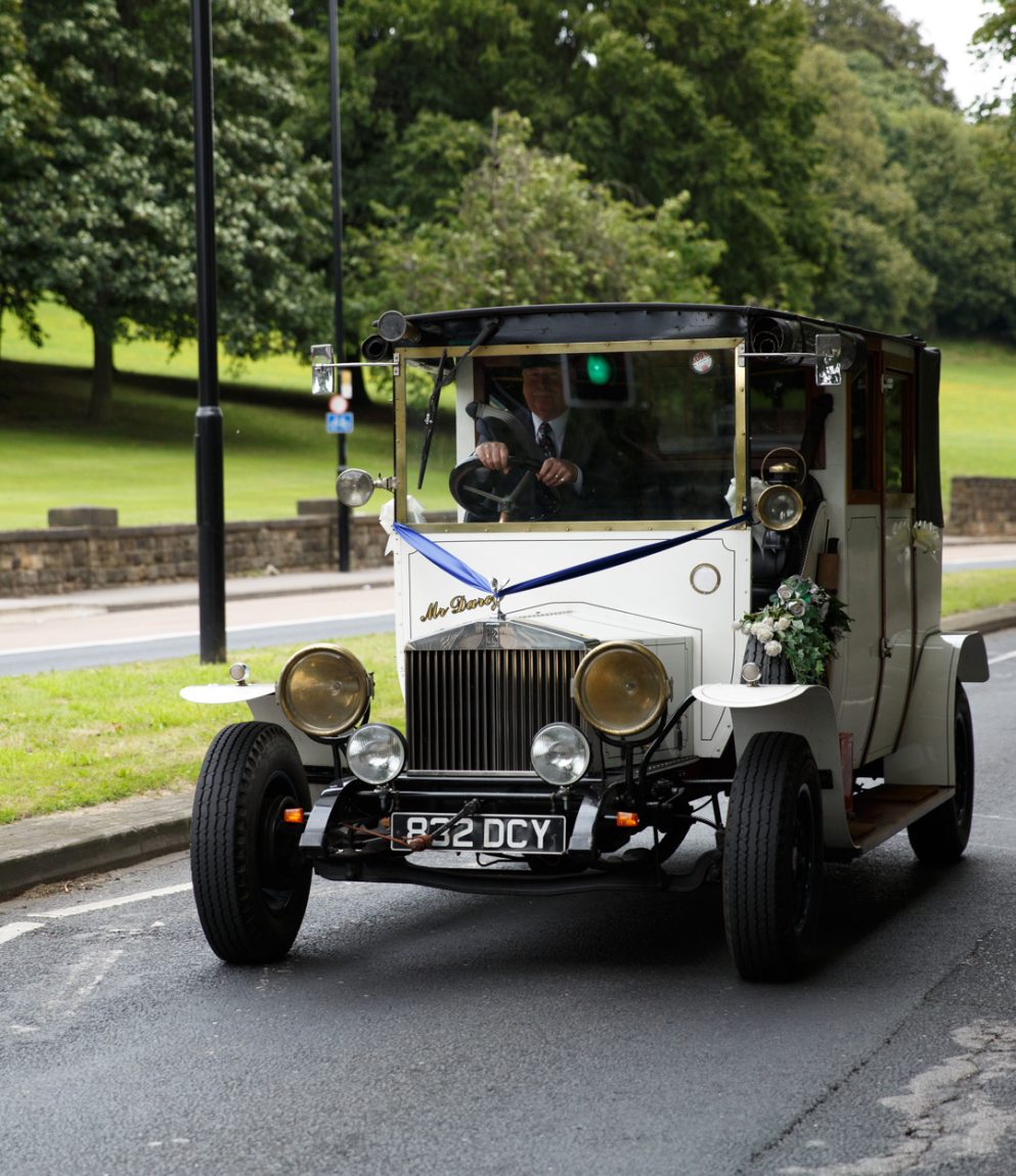 022 vintage wedding car affectionally known as mr darcey arriving on kirkstall road kirkstall abbey wedding linsey and chris