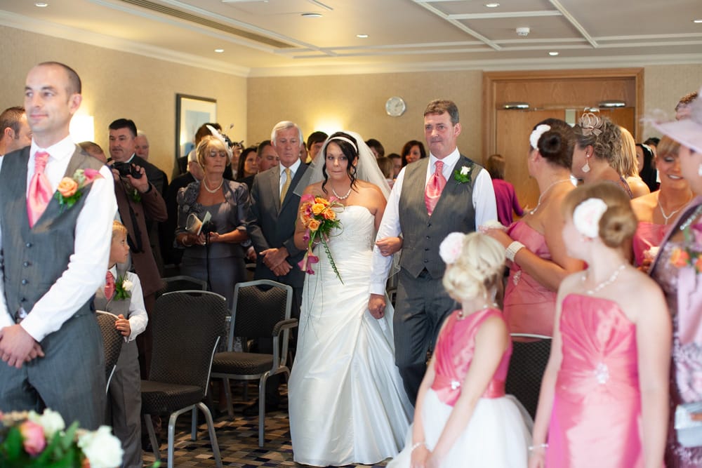 Gemma walks with her father, biting her lip, as Dave looks ahead and begins to smile.