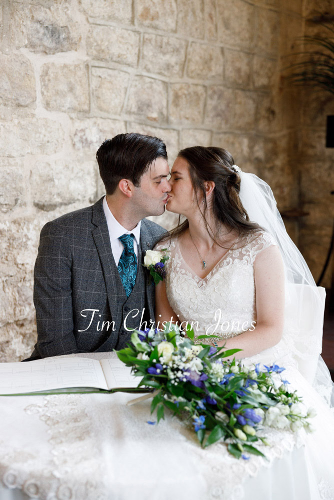 Romantic Yorkshire wedding couple at the register table