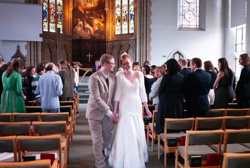 024 couple walk down the aisle st georges leeds catherine and philip