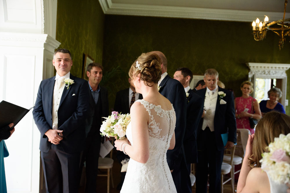 Bride arrives at the front of the ceremony to a warm smile from Neal.
